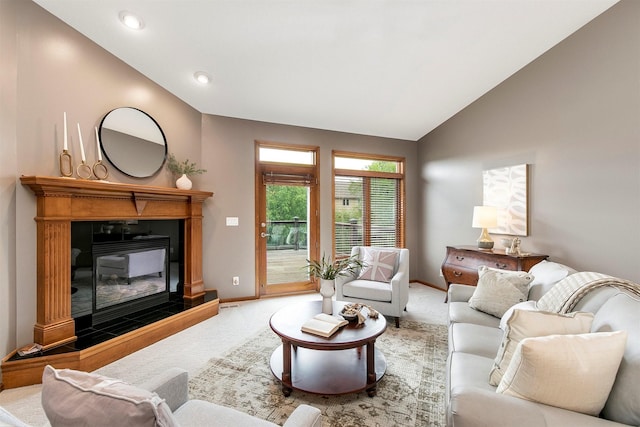 3605 151st St, Urbandale, IA 50323 - carpeted living area featuring lofted ceiling, baseboards, recessed lighting, and a tiled fireplace