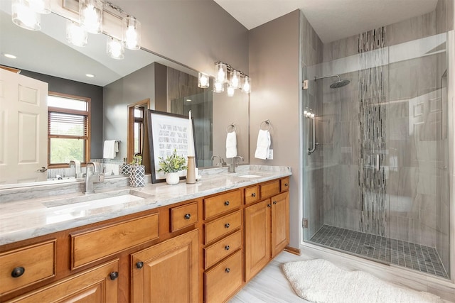 3605 151st St, Urbandale, IA 50323 - bathroom with a stall shower and double vanity
