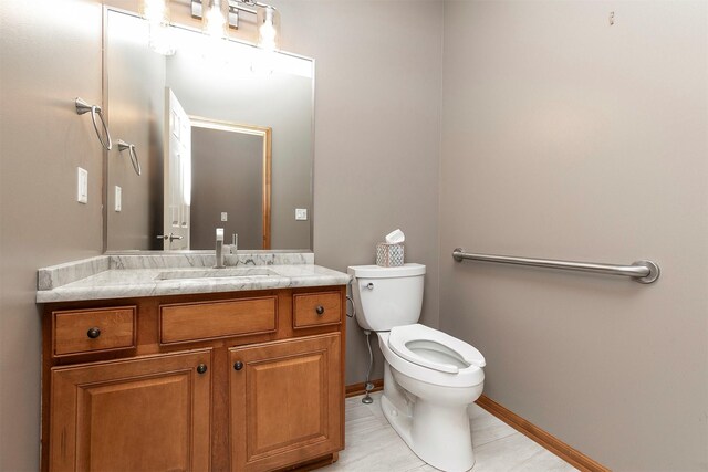 3605 151st St, Urbandale, IA 50323 - half bathroom with vanity, toilet, tile patterned floors, and baseboards