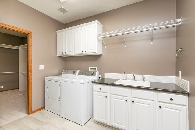 3605 151st St, Urbandale, IA 50323 - laundry area with cabinet space and washer and clothes dryer