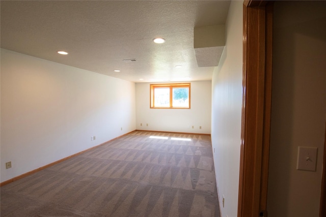 712 63rd St, West Des Moines, IA 50266 - carpeted spare room with baseboards, recessed lighting, and a textured ceiling