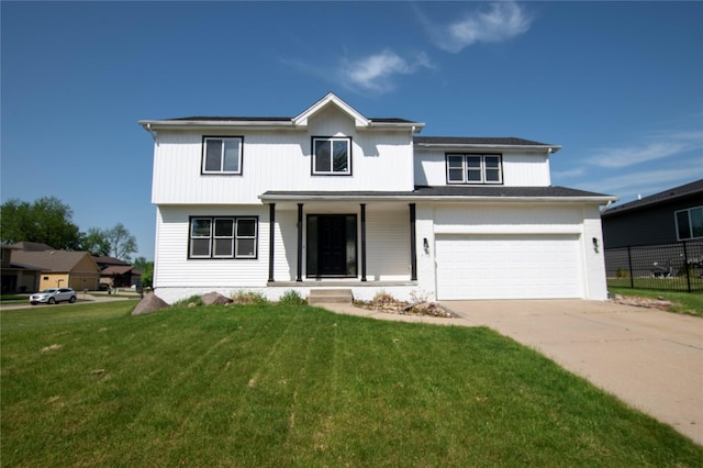 712 63rd St, West Des Moines, IA 50266 - view of front of home with covered porch, concrete driveway, and an attached garage