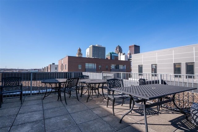 119 4th St Unit 102, Des Moines, IA 50309 - view of patio / terrace featuring outdoor dining area