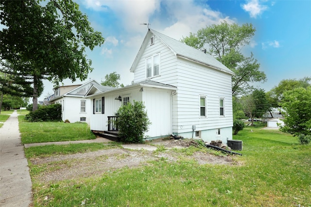 109 Greene St, Boone, IA 50036 - view of property exterior with central AC unit and a lawn