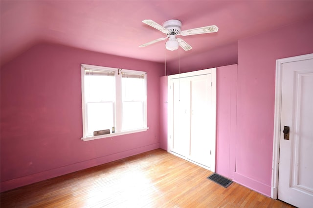 109 Greene St, Boone, IA 50036 - unfurnished bedroom with light wood-type flooring, vaulted ceiling, a ceiling fan, and a closet