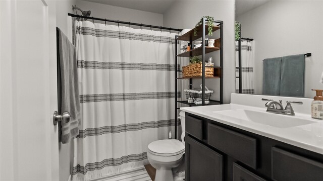 812 Juniper St NW, Bondurant, IA 50035 - full bathroom with vanity, toilet, and a shower with curtain