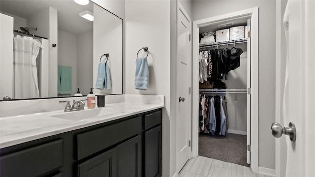 812 Juniper St NW, Bondurant, IA 50035 - bathroom with vanity and a spacious closet