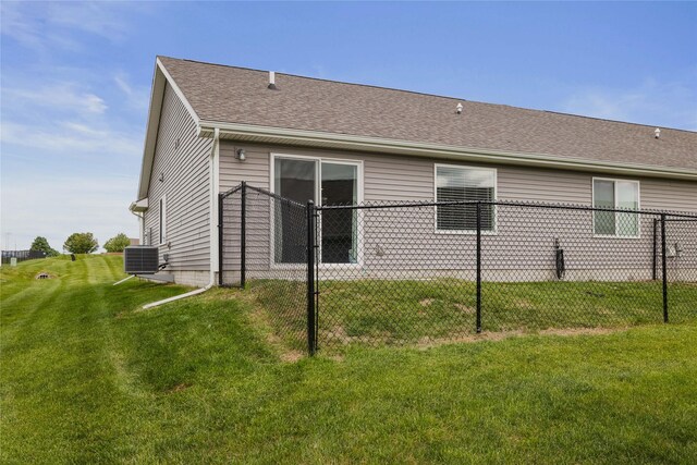 812 Juniper St NW, Bondurant, IA 50035 - back of house featuring a shingled roof and central AC