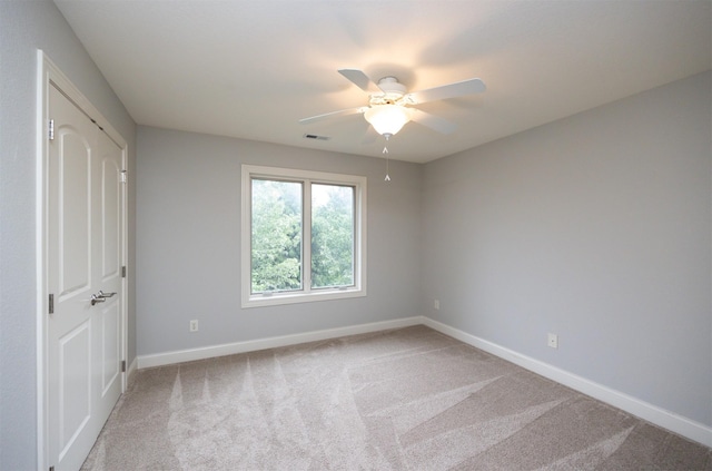 123 62nd St, West Des Moines, IA 50266 - unfurnished bedroom featuring baseboards, carpet flooring, a ceiling fan, and a closet