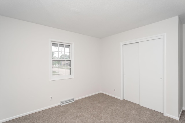 406 SE Trilein Dr, Ankeny, IA 50021 - unfurnished bedroom with carpet floors, baseboards, and a closet