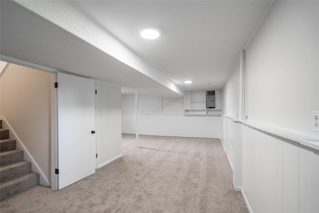 406 SE Trilein Dr, Ankeny, IA 50021 - finished below grade area featuring light carpet, stairs, and electric panel