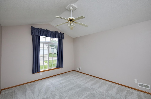 6200 Ep True Pkwy Unit 601, West Des Moines, IA 50266 - empty room with baseboards, vaulted ceiling, a ceiling fan, carpet, and a textured ceiling