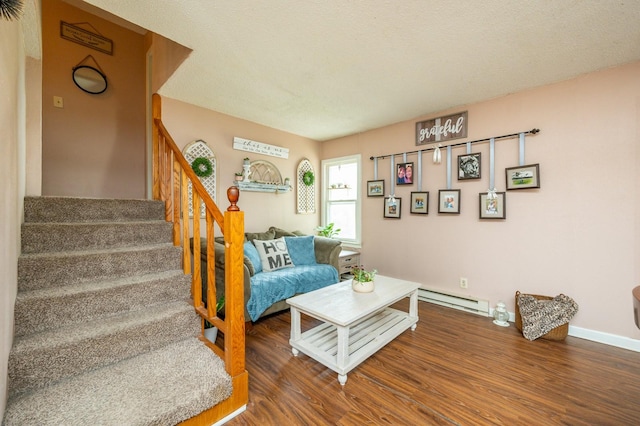 404 E 21st St S, Newton, IA 50208 - living room featuring a baseboard radiator, stairs, wood finished floors, and baseboards