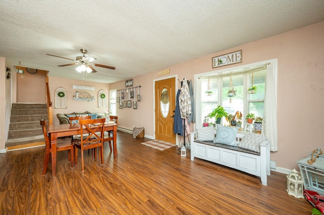 404 E 21st St S, Newton, IA 50208 - dining room with a ceiling fan, wood finished floors, stairway, baseboards, and a textured ceiling