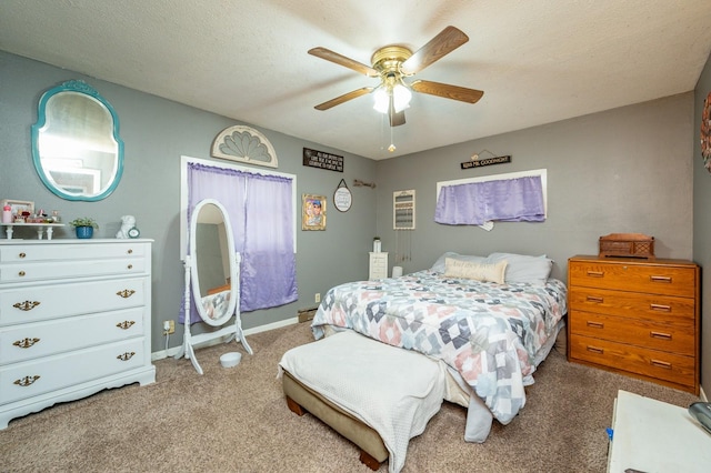 404 E 21st St S, Newton, IA 50208 - bedroom featuring carpet flooring, ceiling fan, and baseboards
