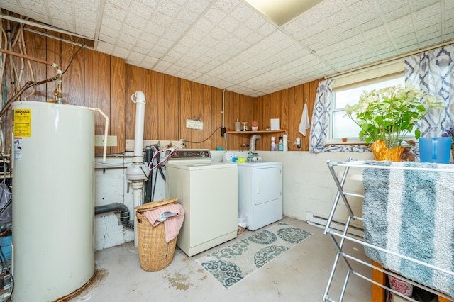 404 E 21st St S, Newton, IA 50208 - laundry area with water heater, washer and dryer, and wooden walls