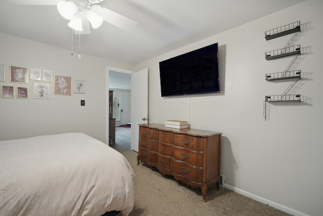 819 Olinda Ave, Des Moines, IA 50315 - bedroom with light colored carpet, a ceiling fan, and baseboards