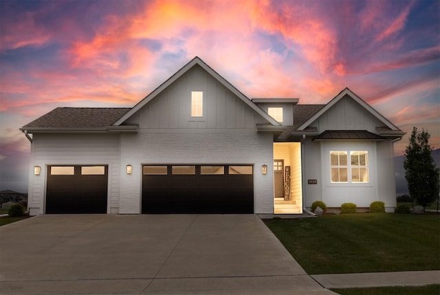 5018 NE Seneca Dr, Ankeny, IA 50021 - view of front facade with concrete driveway, a lawn, a garage, and board and batten siding