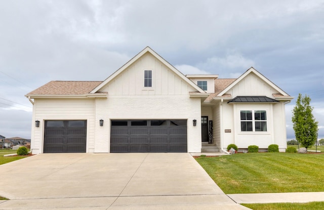 5018 NE Seneca Dr, Ankeny, IA 50021 - view of front of home with driveway, a front yard, an attached garage, and board and batten siding