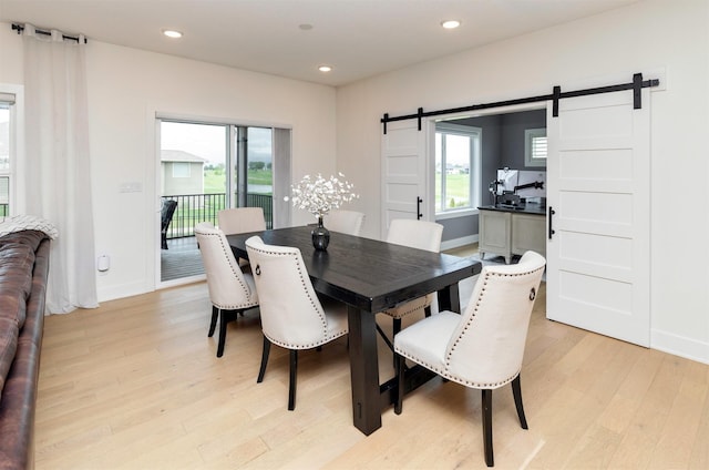 5018 NE Seneca Dr, Ankeny, IA 50021 - dining room with a barn door, light wood-type flooring, baseboards, and recessed lighting