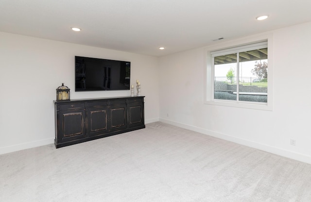 5018 NE Seneca Dr, Ankeny, IA 50021 - unfurnished living room with light carpet, recessed lighting, and baseboards