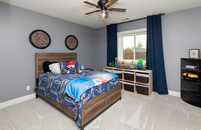 5018 NE Seneca Dr, Ankeny, IA 50021 - bedroom featuring light colored carpet, baseboards, and ceiling fan