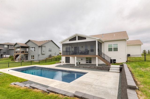 5018 NE Seneca Dr, Ankeny, IA 50021 - back of property with a sunroom, stairs, and a patio area