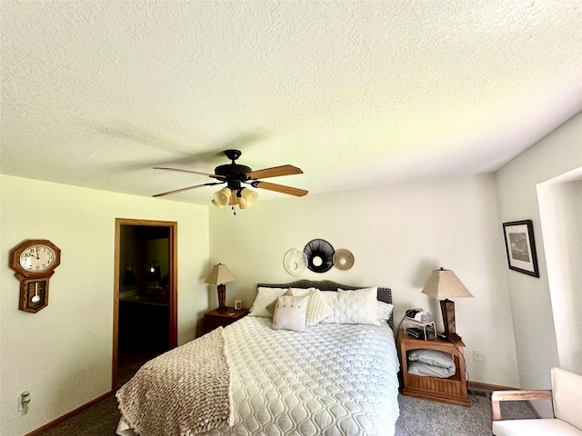 902 W Filmore St, Winterset, IA 50273 - bedroom featuring carpet flooring, a ceiling fan, baseboards, and a textured ceiling