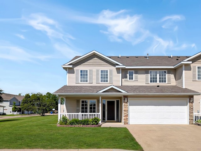 2101 Meadow Ct Unit 1304, Des Moines, IA 50320 - view of front of house with covered porch, concrete driveway, a garage, a front lawn, and stone siding