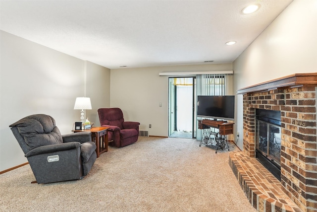 4829 86th St Unit 6, Urbandale, IA 50322 - carpeted living room with a fireplace, baseboards, and recessed lighting