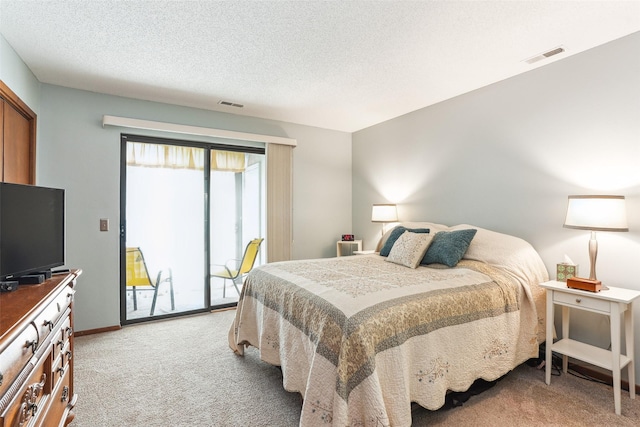 4829 86th St Unit 6, Urbandale, IA 50322 - bedroom with light carpet, access to exterior, a textured ceiling, and baseboards