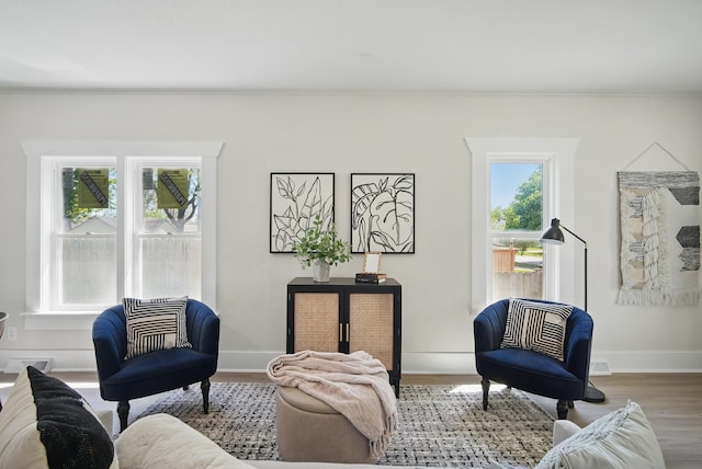 1519 Searle St, Des Moines, IA 50317 - living area featuring wood finished floors and ornamental molding
