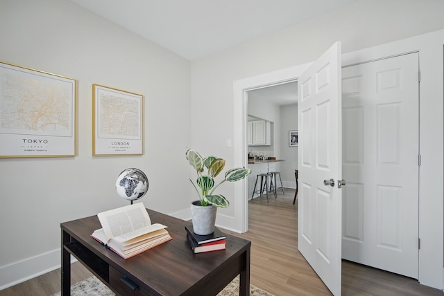 1519 Searle St, Des Moines, IA 50317 - office area featuring light wood-style flooring and baseboards