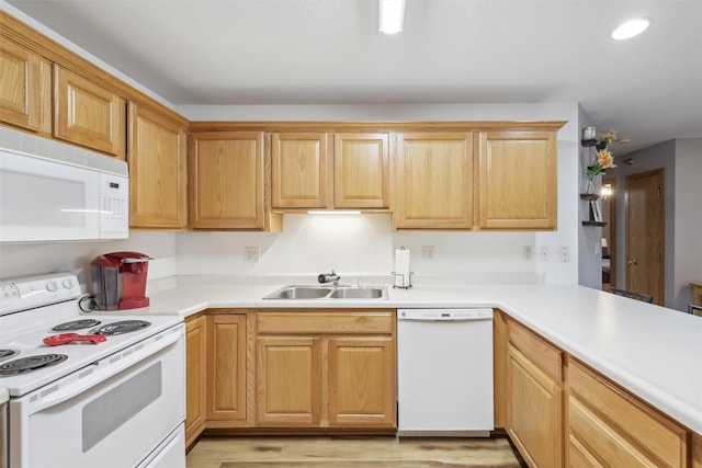 1265 SE 6th St Unit 104, Grimes, IA 50111 - kitchen with white appliances, a sink, light countertops, light wood-style flooring, and recessed lighting