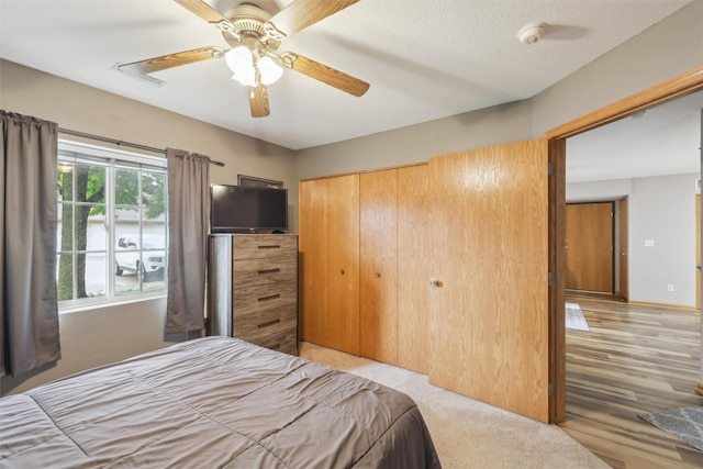 1265 SE 6th St Unit 104, Grimes, IA 50111 - bedroom with a closet and ceiling fan
