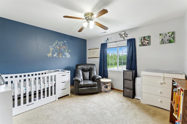 1265 SE 6th St Unit 104, Grimes, IA 50111 - carpeted bedroom with a crib and a ceiling fan