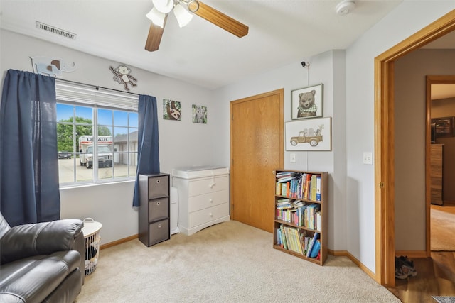 1265 SE 6th St Unit 104, Grimes, IA 50111 - living area with carpet floors, a ceiling fan, and baseboards