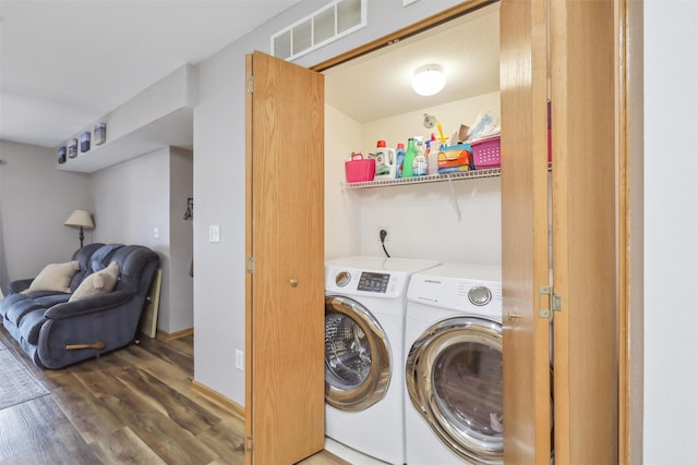1265 SE 6th St Unit 104, Grimes, IA 50111 - laundry room with washer and dryer and wood finished floors