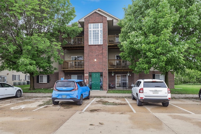 1265 SE 6th St Unit 104, Grimes, IA 50111 - view of building exterior with uncovered parking