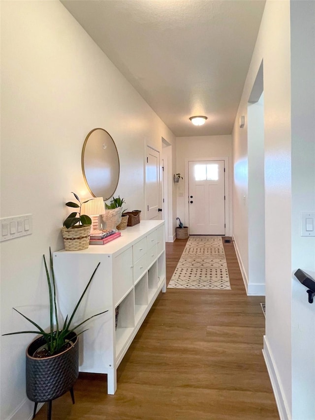 1932 Strauss Ave, Adel, IA 50003 - entryway featuring wood finished floors and baseboards