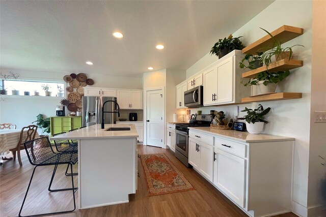 1932 Strauss Ave, Adel, IA 50003 - kitchen with stainless steel appliances, dark wood finished floors, white cabinets, and recessed lighting