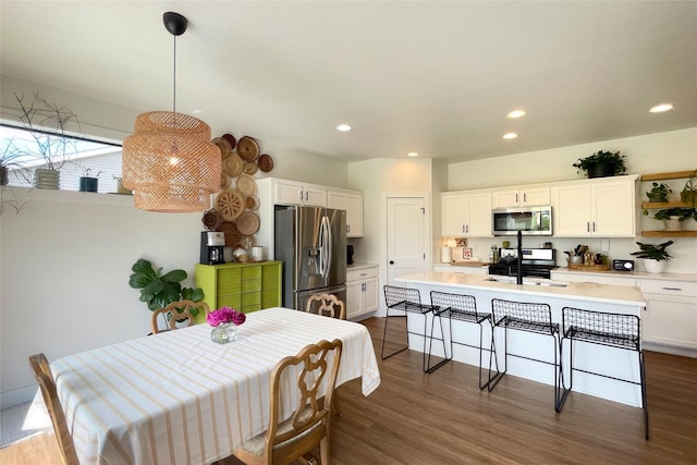 1932 Strauss Ave, Adel, IA 50003 - dining space featuring dark wood-style flooring and recessed lighting