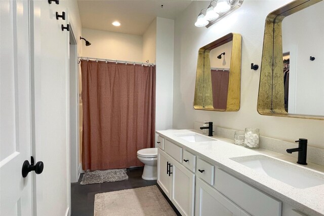 1932 Strauss Ave, Adel, IA 50003 - full bathroom with double vanity, toilet, a shower with curtain, and recessed lighting