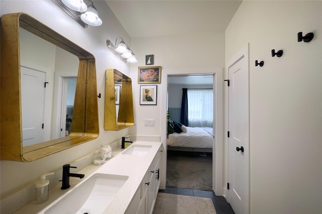 1932 Strauss Ave, Adel, IA 50003 - bathroom with connected bathroom, double vanity, and tile patterned floors