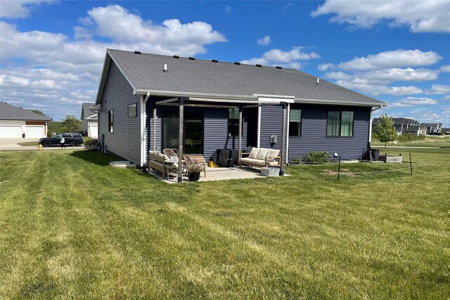 1932 Strauss Ave, Adel, IA 50003 - rear view of house with a patio, a lawn, and an outdoor living space
