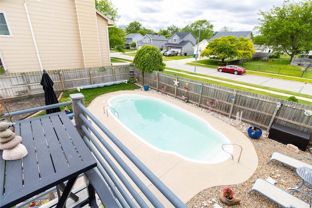 704 13th St SE, Altoona, IA 50009 - view of swimming pool featuring a residential view and a fenced backyard