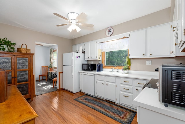 500 8th St, Waukee, IA 50263 - kitchen featuring white appliances, plenty of natural light, a ceiling fan, and light countertops