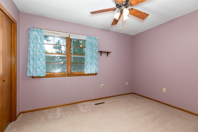 500 8th St, Waukee, IA 50263 - unfurnished room with light carpet, baseboards, and a ceiling fan