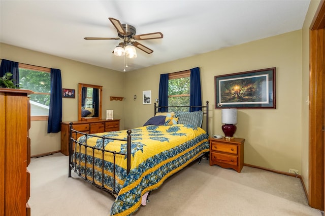 500 8th St, Waukee, IA 50263 - carpeted bedroom featuring baseboards and a ceiling fan