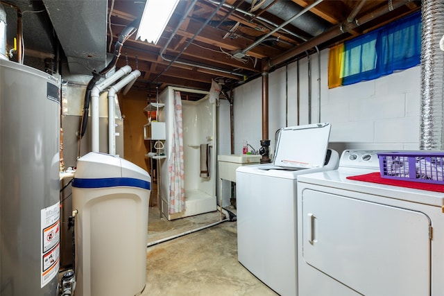 500 8th St, Waukee, IA 50263 - unfinished basement featuring washing machine and clothes dryer, gas water heater, and a sink
